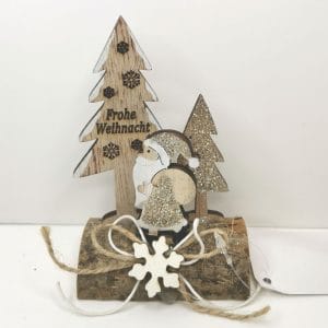 Decorazione natalizia su tronco con glitter