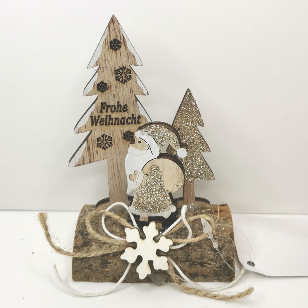 Decorazione natalizia su tronco con glitter